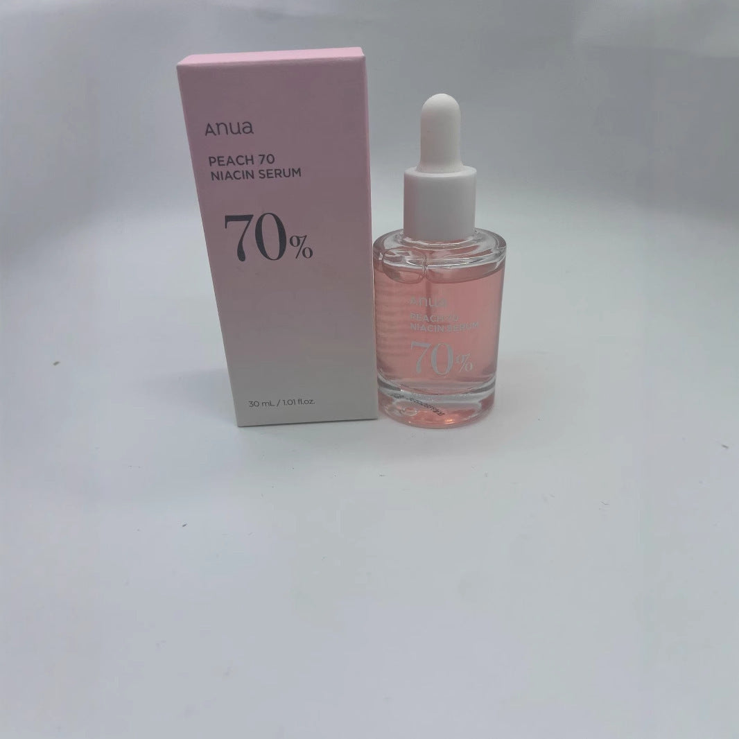 “Siero viso Anua Peach 70 Niacin Serum 30 ml, flacone rosa con contagocce e confezione”